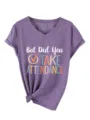 Close up of purple V-neck short sleeve t-shirt detail showing chest letter print and tied hem. - Purple