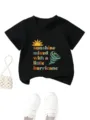 Close-up detail of the graphic print and soft black fabric on the children's t-shirt. - 90 / Tops / Black