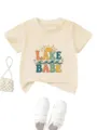 Detailed view of the cute kids short-sleeve tee featuring lake babe print and summer vibes. - Apricot