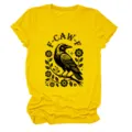 Close-up detail of the yellow short-sleeve t-shirt featuring a black crow and floral graphic. - S / Tops / Yellow (Black Text Color Graphic)