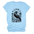 Close-up detail of the light blue women's t-shirt featuring a stylish black raven floral graphic print. - S / Tops / Light Blue (Black Letters Multicolor Graphic)