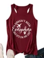 Close-up detail of the maroon racerback tank top featuring travel quote white print. - Burgundy