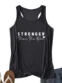 Close-up detail of women casual black racerback tank top featuring white motivational storm quote print. - S / Tops / Dark Gray