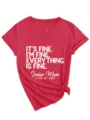 Close-up detail of red V-neck t-shirt with white slogan graphic print and side knot design. - S / Tops / Red