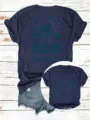 Lässiges lockeres Damen Kurzarm Rundhals T-Shirt mit Retro Sonnenuntergang Palmen Grafik. - Oberteile / Marineblau / S