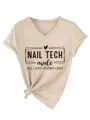 Casual beige V-neck short sleeve t-shirt detail showing nail tech print and knot hem. - S / Tops / Sand
