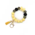 Silicone bead keychain bracelet, yellow leopard print wristlet with bow and tassel. - Yellow
