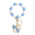 Blue white silicone bead keychain bracelet with cute butterfly charm for women daily use. - Blue