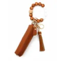 Brown beaded wristlet keychain with leather pouch and tassel, stylish accessory for women. - Brown