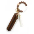 Silicone bead wristlet keychain with brown leather zipper pouch and white tassel pendant - Coffee