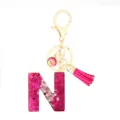 Pink glitter resin initial N keychain with gold hardware tassel and fish scale pendant. - Pink Sequin Tassel Keychain / Letter N