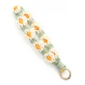 Handmade crochet daisy wrist strap keychain for phone, cute woven flower strap accessory. - Wrist Strap Charm / Beige and Green