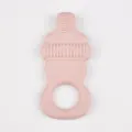 Pink silicone baby teether detail view, infant pacifier chewing toy with safe grip ring and texture. - Cinnamon Pink