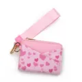 Pink leather card holder wallet with wrist strap, cute heart print and gold tone hardware. - Pink