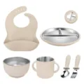 Stainless steel baby feeding set with silicone suction divided plate, bowl, cup, bib, spoon, fork. - Beige