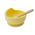 Yellow silicone baby suction bowl set with wooden handle spoon for infant feeding training. - Yellow