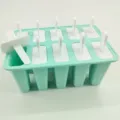 Mint green silicone ice pop mold with white lids for homemade delicious frozen treats. - 10 Grids / Green