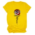 Detailed view of women's yellow short sleeve T-shirt featuring American flag rose design. - S / Tops / Yellow