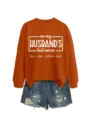 Detailansicht des orangefarbenen Damen-Herbstsweatshirts mit Aufdruck und Jeansshorts. - S / Oberteile / Gebranntes Orange (Weiße Schrift)