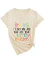 Close-up of the front printed graphic and stylish side knot detail on the beige women V-neck tee. - S / Tops / Sand