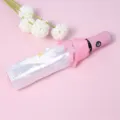 Pink automatic folding umbrella with a clear daisy pattern cover and cute floral prop. - Fully Automatic Umbrella in Pink