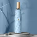Paraguas plegable azul claro con mango de madera, paraguas solar compacto para mujeres. - Paraguas manual de 3 pliegues y 8 varillas con mango de madera - Azul claro con revestimiento negro