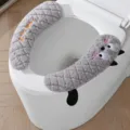Plush toilet seat cover in gray with cute cat design, handle, and adhesive strap, 1 pair pack. - Thick Velcro Toilet Seat Covers (1 Pair) - Grey Cat