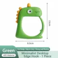 Joli crochet de sac de dinosaure de dessin animé pour bureau, cintre de table portable robuste. - Vert
