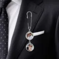 Close-up detail of custom photo brooch featuring silver safety pin and double picture charms. - 21