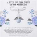 Close-up detail of wedding guardian angel pearl brooch with memorial message card display. - New Style 1: Pearl Angel