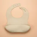 Waterproof silicone baby bib with crumb catcher pocket, adjustable toddler feeding bib. - Off White