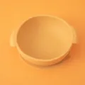 Orange silicone baby suction bowl with dual handles and secure base for infant feeding. - Dinner Plate / Turmeric