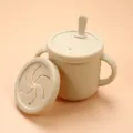 Silicone baby training cup with snack lid and straw, dual handles, safe toddler sippy cup. - Snack Cup / Off White