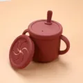 Silicone baby training cup and snack cup with dual handles and straw lid in dark red variant. - Snack Cup / Brick Red