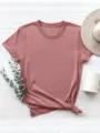 T-shirt a manica corta tinta unita con girocollo e risvolti, perfetta per look casual estivi. - Taglia S / Oro rosa