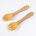 Baby silicone wooden handle training spoon and fork set in yellow color for toddler feeding. - Wooden Handle Fork and Spoon / Turmeric