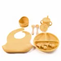 Silicone baby feeding set in yellow, including a divided plate, bowl, bib, cup and spoon variant. - Wooden Handle 8-Piece Set / Turmeric