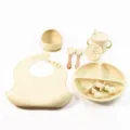 Baby silicone feeding set with suction bowl, divided plate, bib, spoon, fork, and training cup. - Wooden Handle 8-Piece Set / Off White