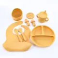 Silicone baby feeding set with divided plate bowl cup bib spoon fork for toddlers. - Silicone 8-Piece Set / Turmeric