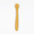 Baby silicone training spoon in yellow, safe food-grade material for toddler self-feeding. - Turmeric