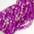 Close-up view of purple crackle glass beads, showing detailed ice crystal texture patterns. - 8mm / Purple