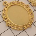Close-up detail of vintage gold alloy oval bezel tray pendant, perfect for DIY crafting. - Style 6