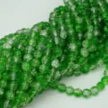Close-up detail of vibrant green crackle glass beads, perfect for DIY jewelry making accessories. - 8mm / Green