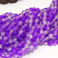 Close up detail of purple crackle glass beads, perfect for DIY jewelry making and accessories. - 4mm / Purple