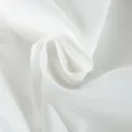 Premium white suit fabric detail showing fine smooth texture and elegant drape style. - S / Tops / White