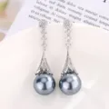Elegant long silver-tone dangle earrings with sparkling cubic zirconia and dark grey pearls. - Earrings Only (Gray Pearl)