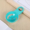 Plastic egg separator tool for kitchen baking, close-up detail shot of turquoise utility gadget. - OPP Bag