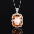 Prachtige oranje edelsteen hangketting met schitterende halo stenen voor elegante dames. - Padparadscha Hanger Ketting
