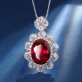 Elegant copper gold-plated simulated red corundum gemstone halo pendant necklace detail view. - Pendant (With Chain) / Ruby Red