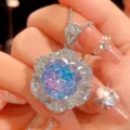 Close-up detail of the stunning gradient crystal flower pendant necklace with shimmering stones. - Necklace / Pink Blue Pendant With Necklace